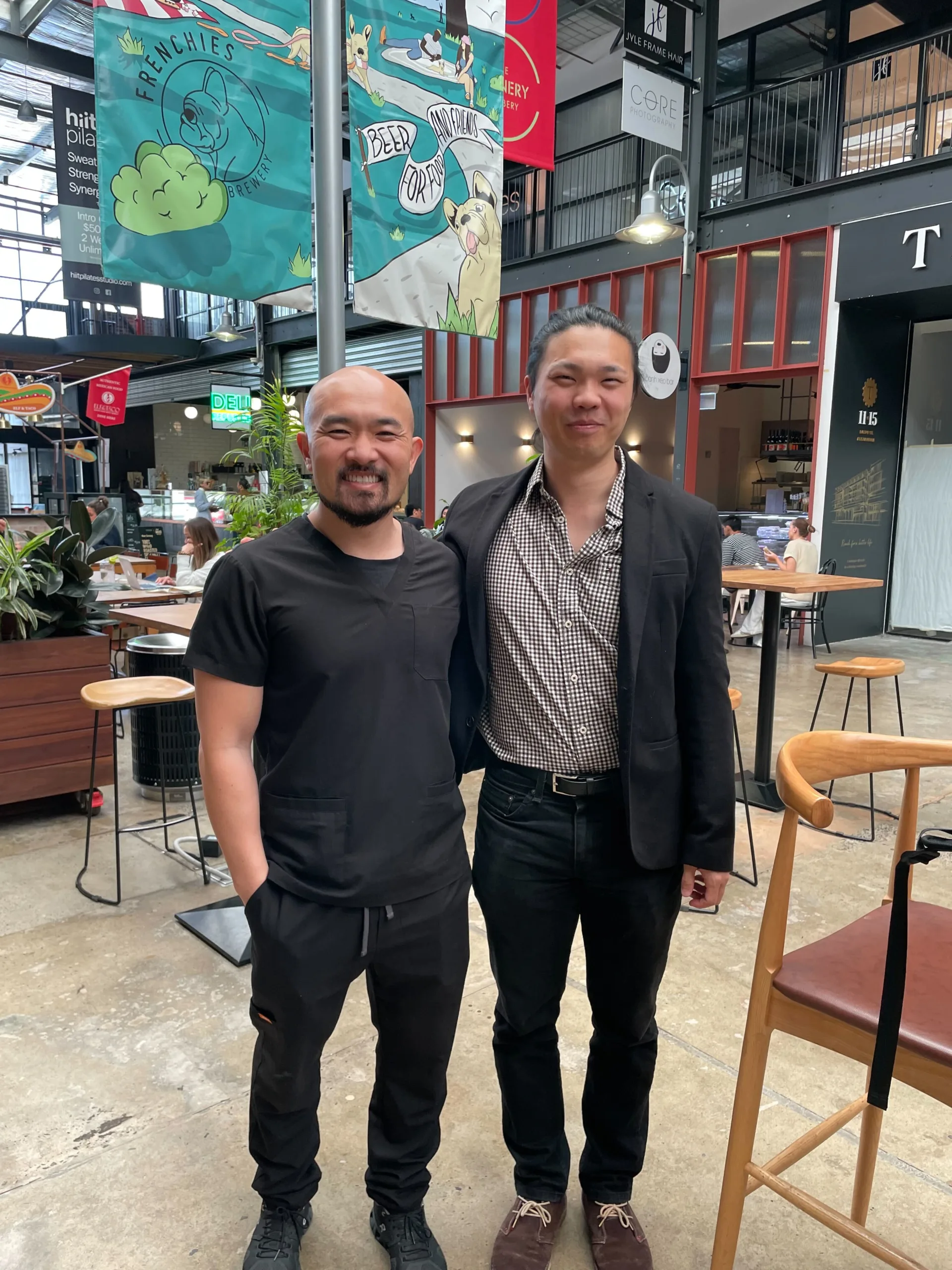 COM Market Leaders owner David Ji posing with owner of Liang Kin Dental