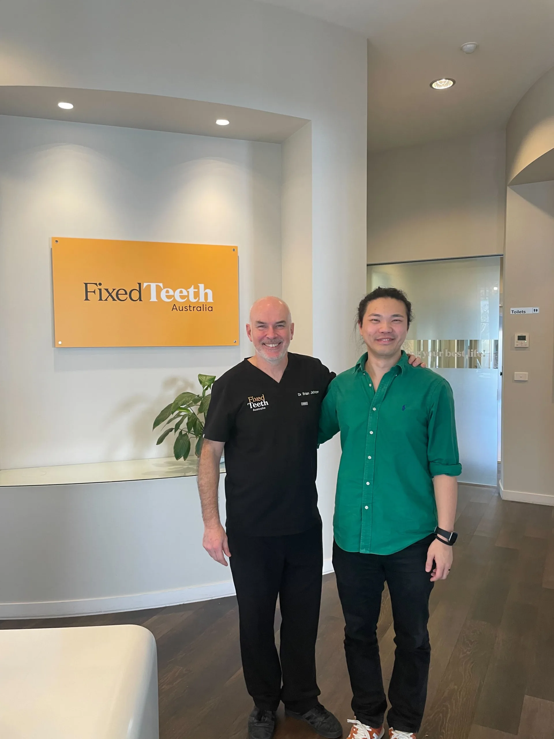 COM Market Leaders owner David Ji posing with owner of Fixed Teeth Australia Brian Johnston
