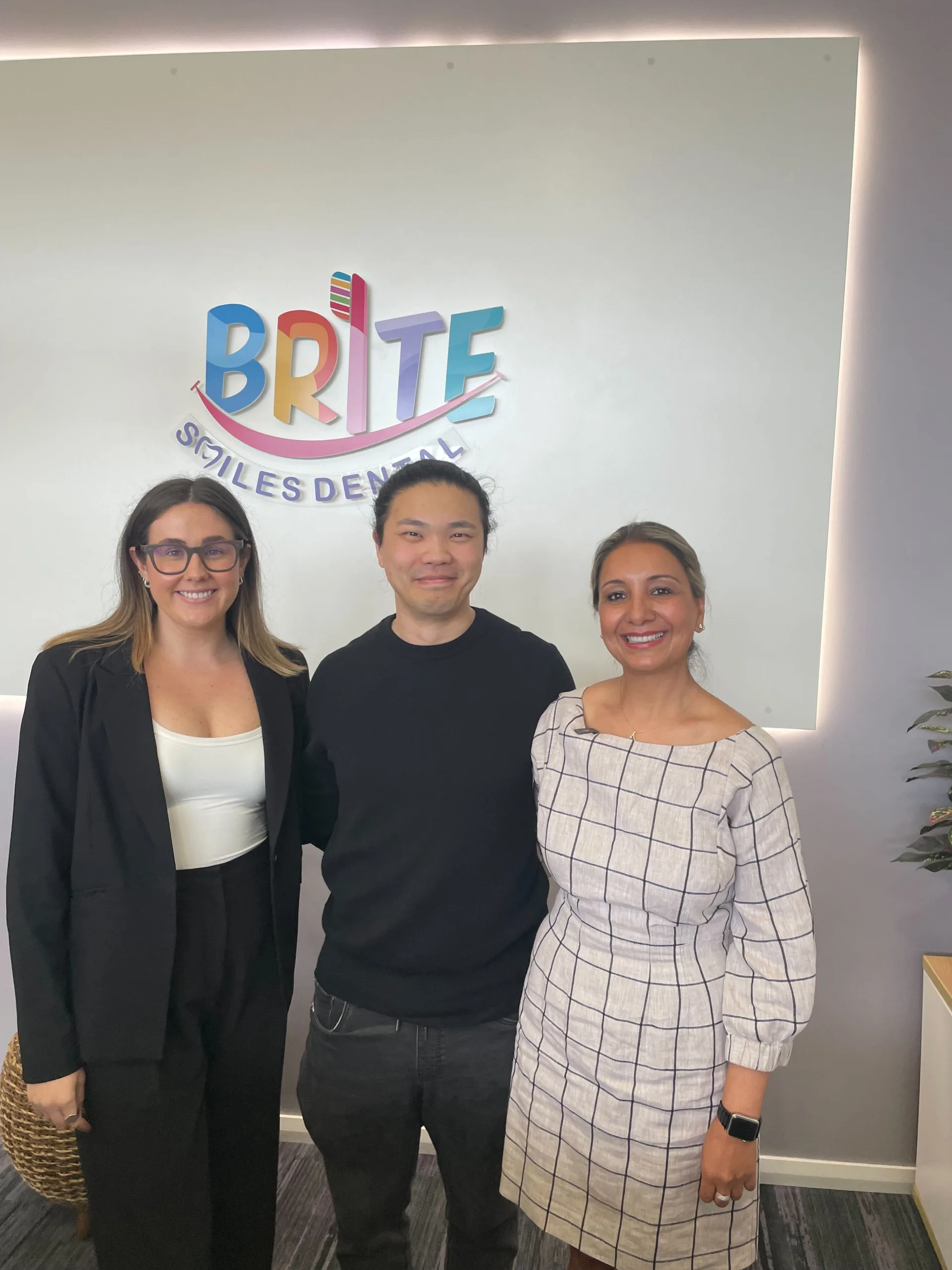 COM Market Leaders owner David Ji posing with owner of Brite Smiles Dental Morisset Dental