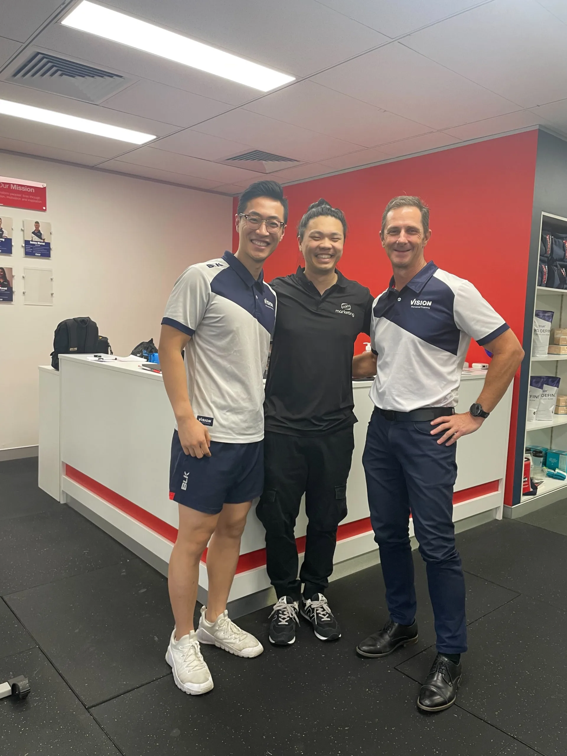 COM Market Leaders owner David Ji posing with owner of Vision Personal Training