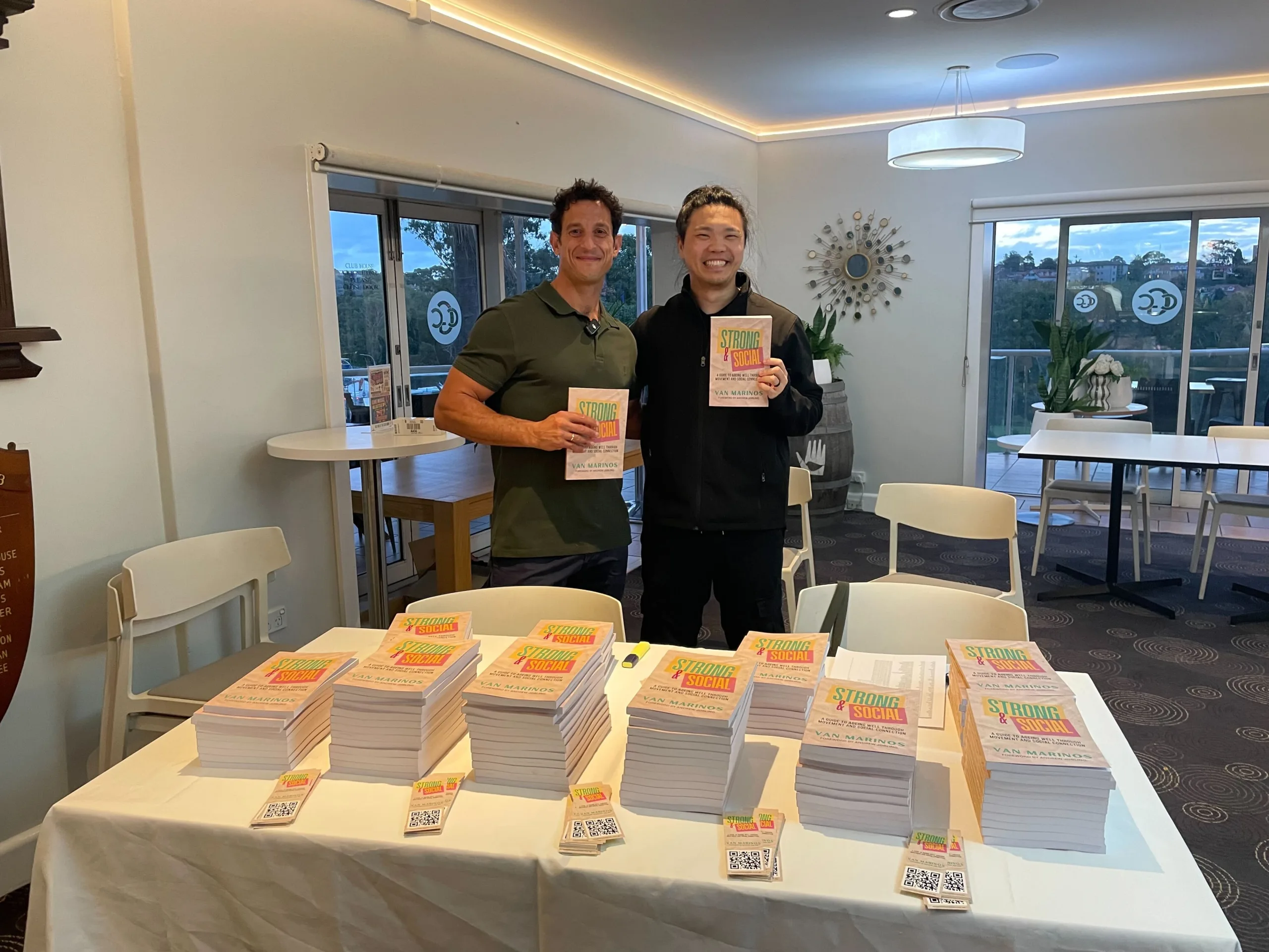 COM Market Leaders owner David Ji posing with owner of Van Merinos Community Moves